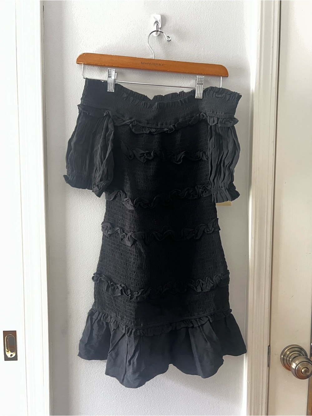 The Impeccable Pig Black Off-Shoulder Ruffle Mini Dress